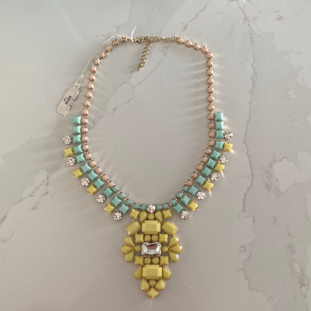 Multi colored statement necklace in yellow, mint green and light pink.